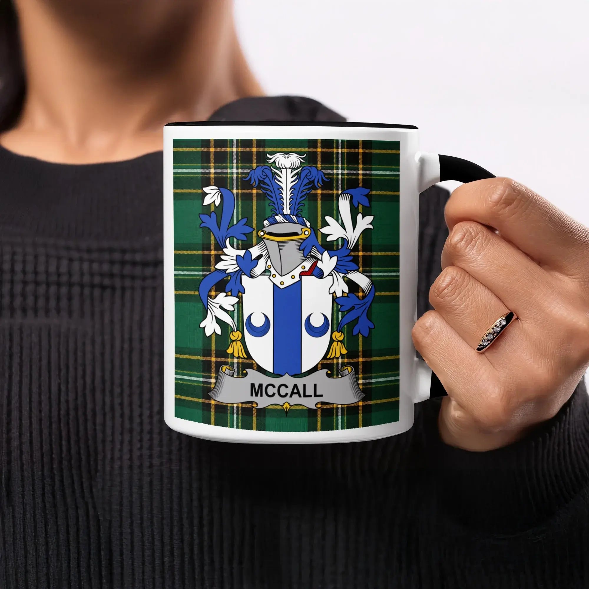 Mug with McCall family crest on plaid background.