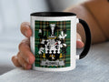 White mug with black handle featuring Aldwell family crest on green plaid.