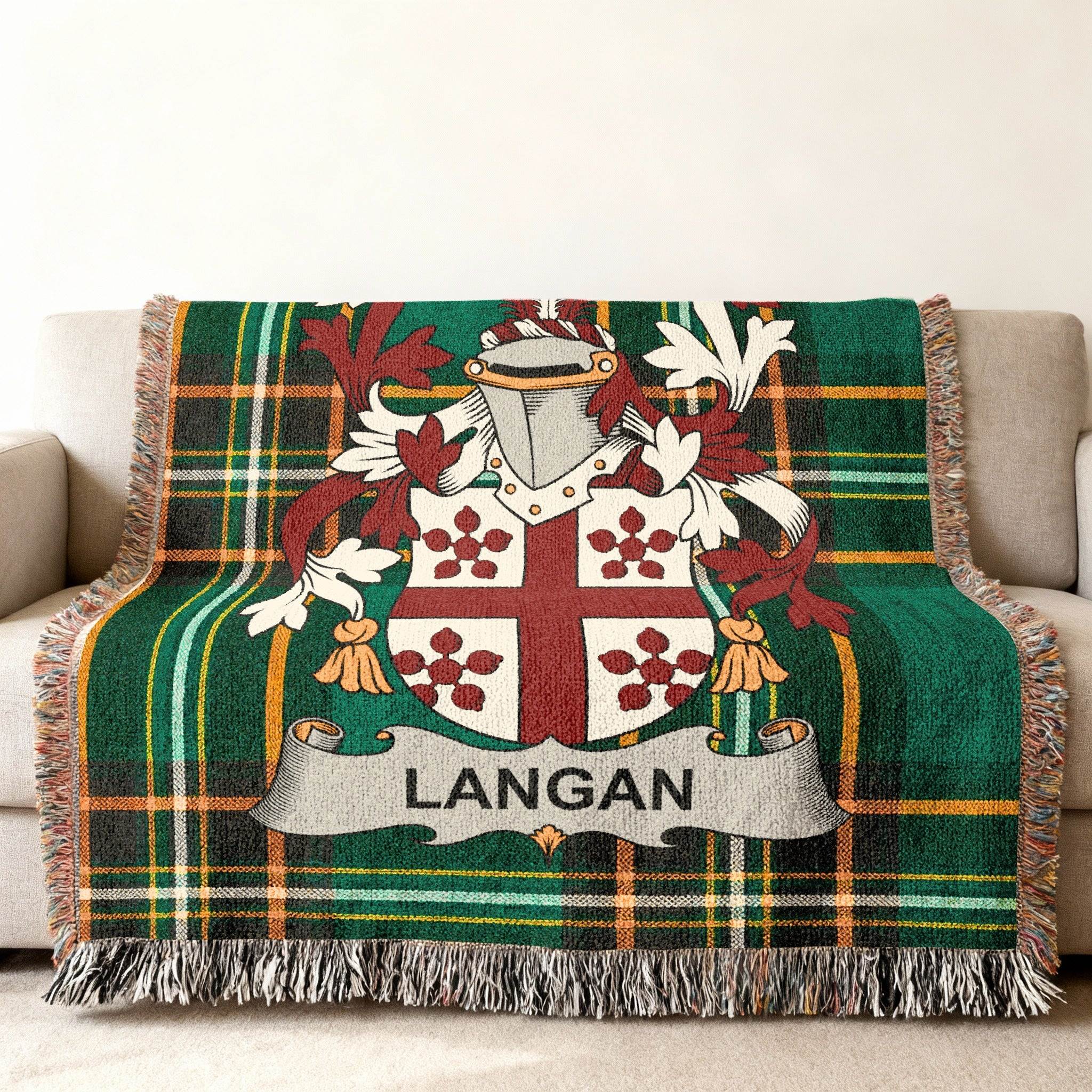 Green tartan throw blanket with Langan family crest.