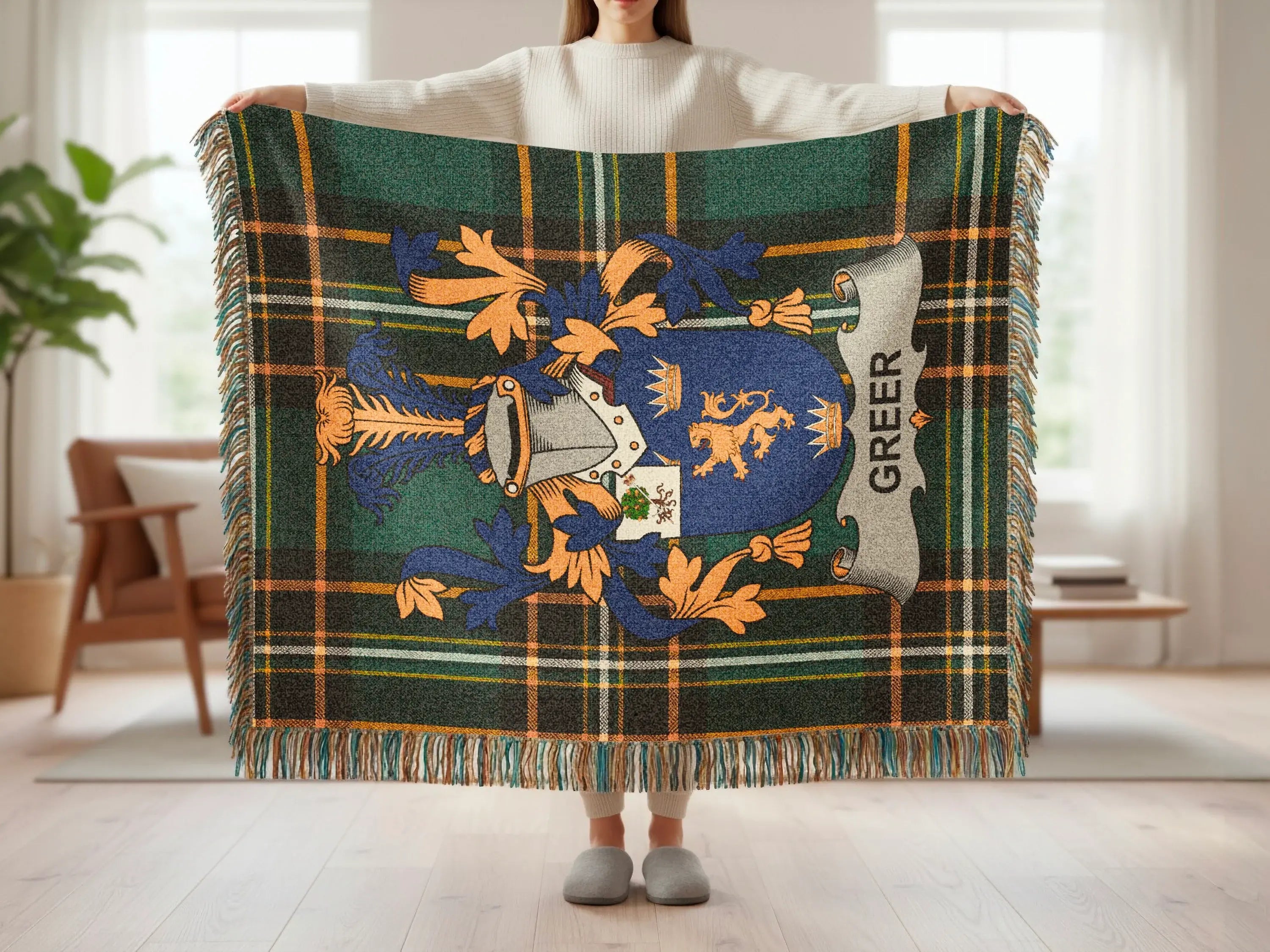 Tartan blanket with Greer family crest in blue, gold, and green.