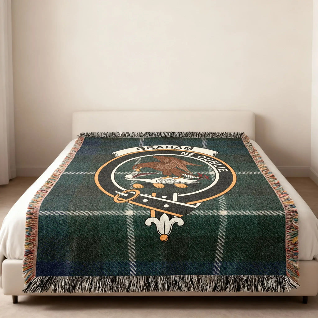 Graham clan Ne Oublie woven blanket folded — showing fringe detail and tartan crest pattern