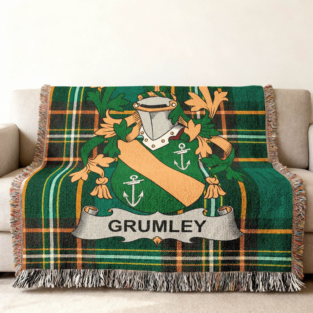 Green tartan blanket with Grumley family crest and fringe.