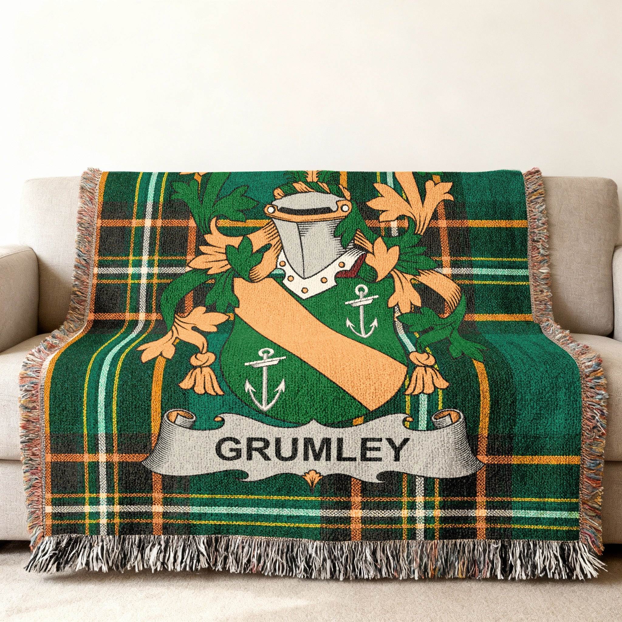 Green tartan blanket with Grumley family crest and fringe.