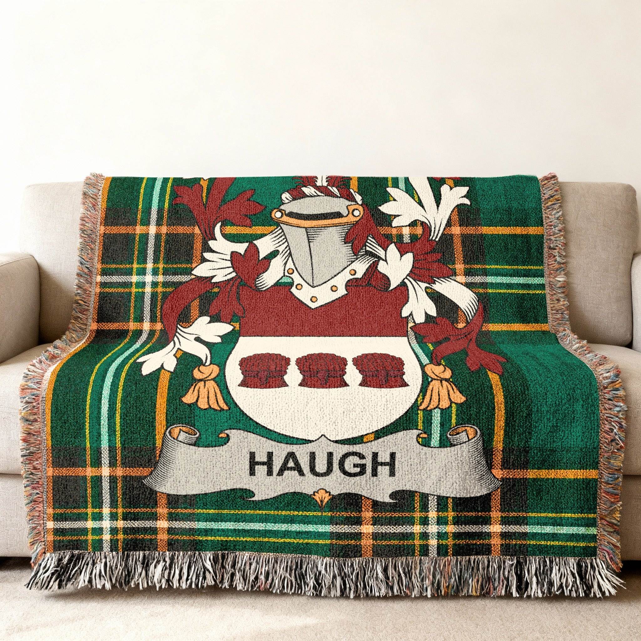 Green plaid blanket with the Haugh family crest.