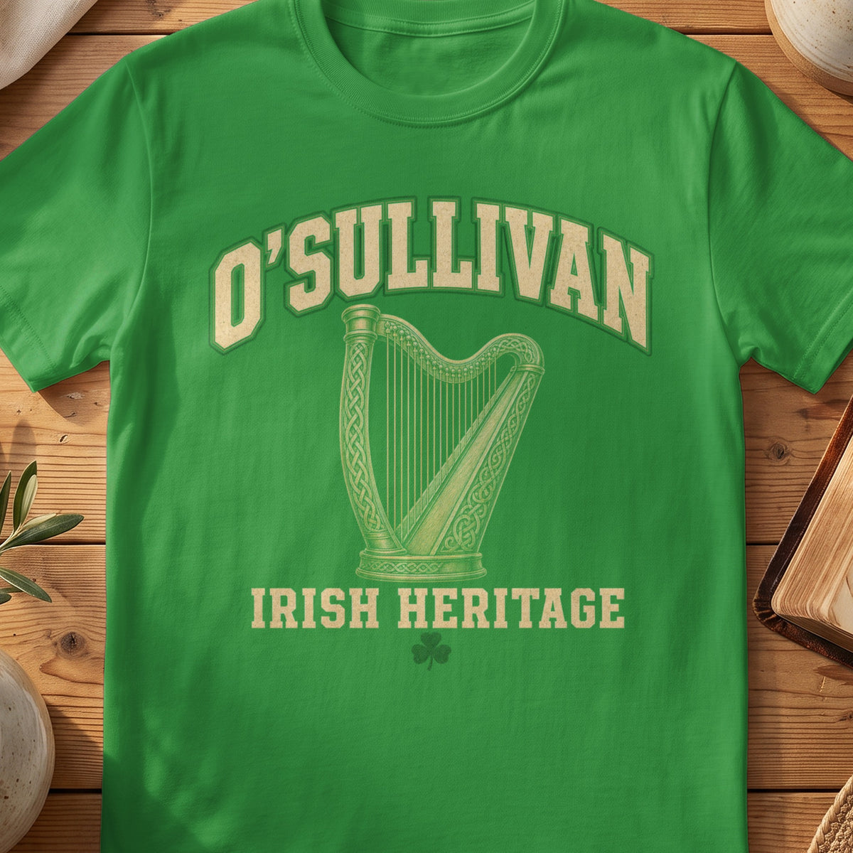 O'Sullivan Irish harp T-shirt in Irish Green, with cream surname lettering, a gold-toned harp, green shamrock and “Irish Heritage” text.