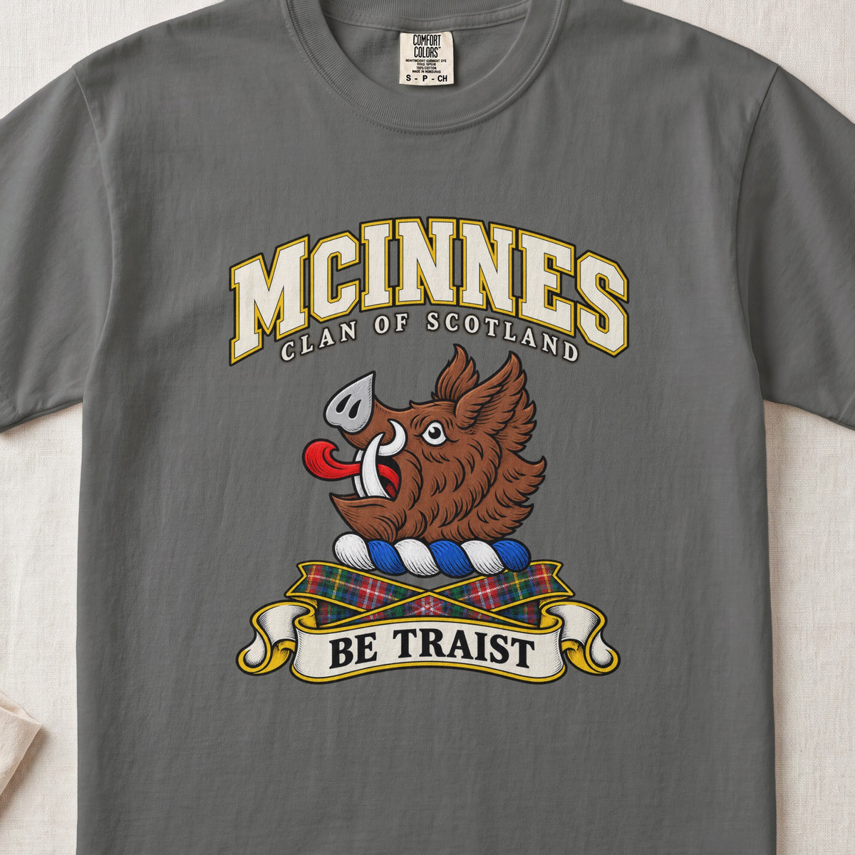 McInnes Scottish clan T-shirt in Pepper, front view with a brown boar head and motto design.