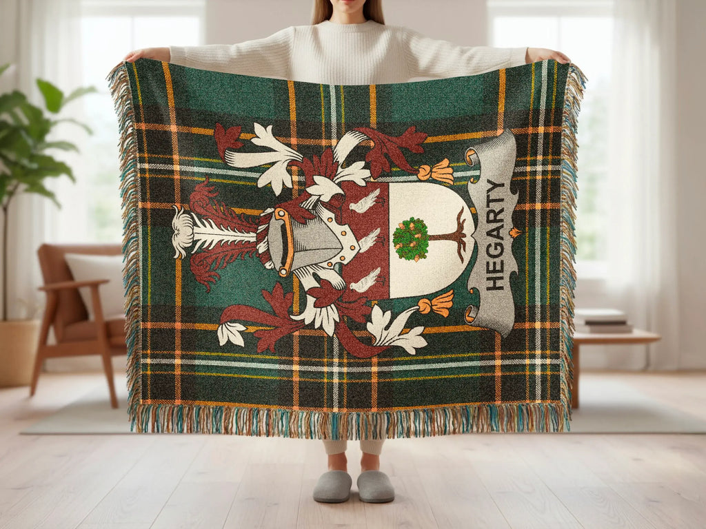 Hegarty tartan blanket with coat of arms held by a person.