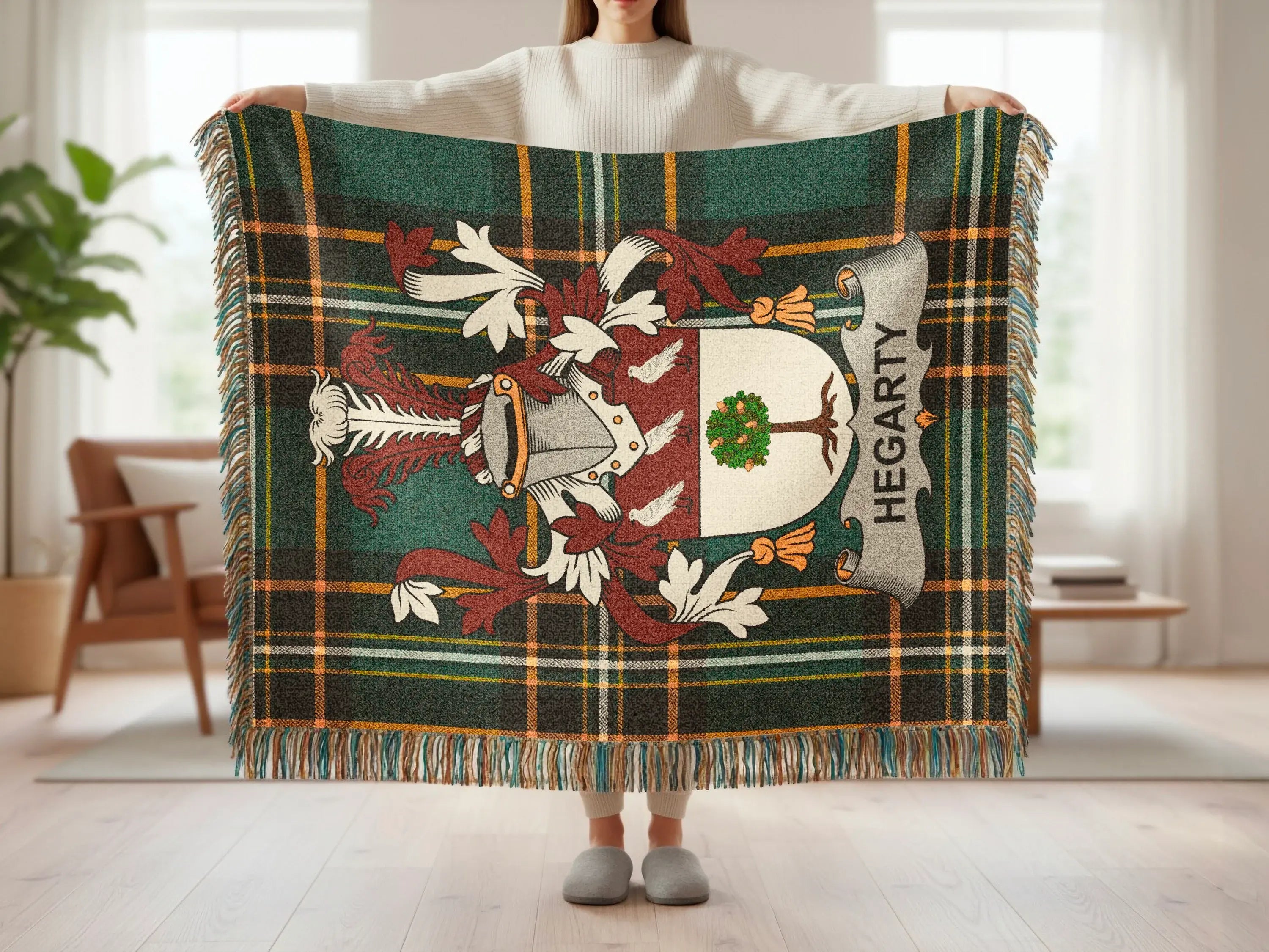 Hegarty tartan blanket with coat of arms held by a person.