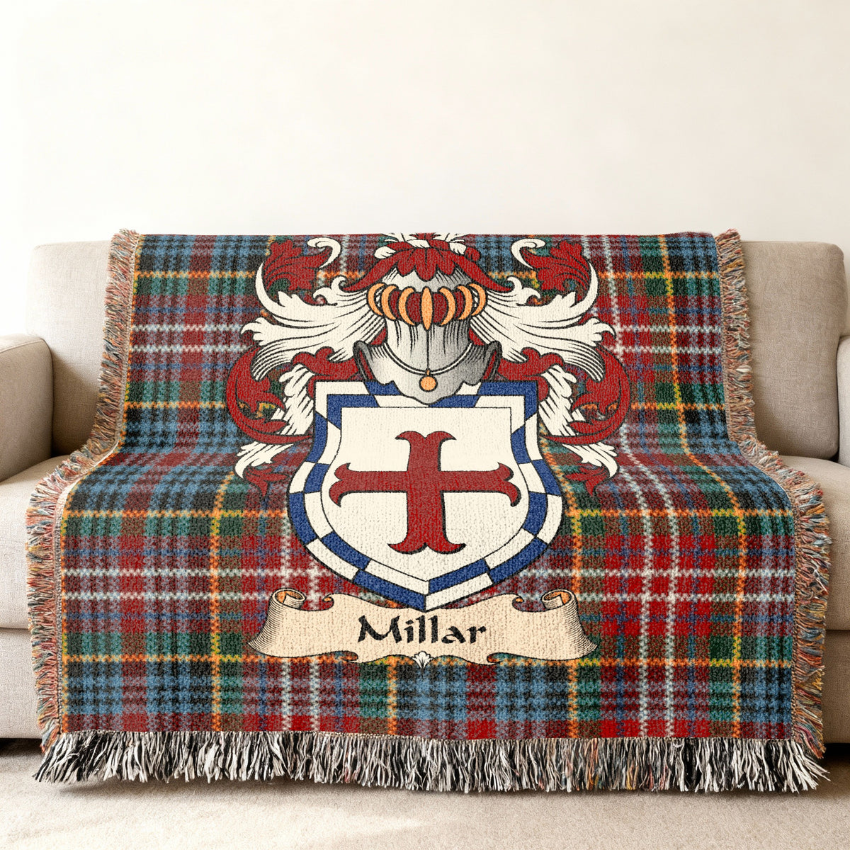 Millar family crest emblem on a Caledonia tartan woven blanket