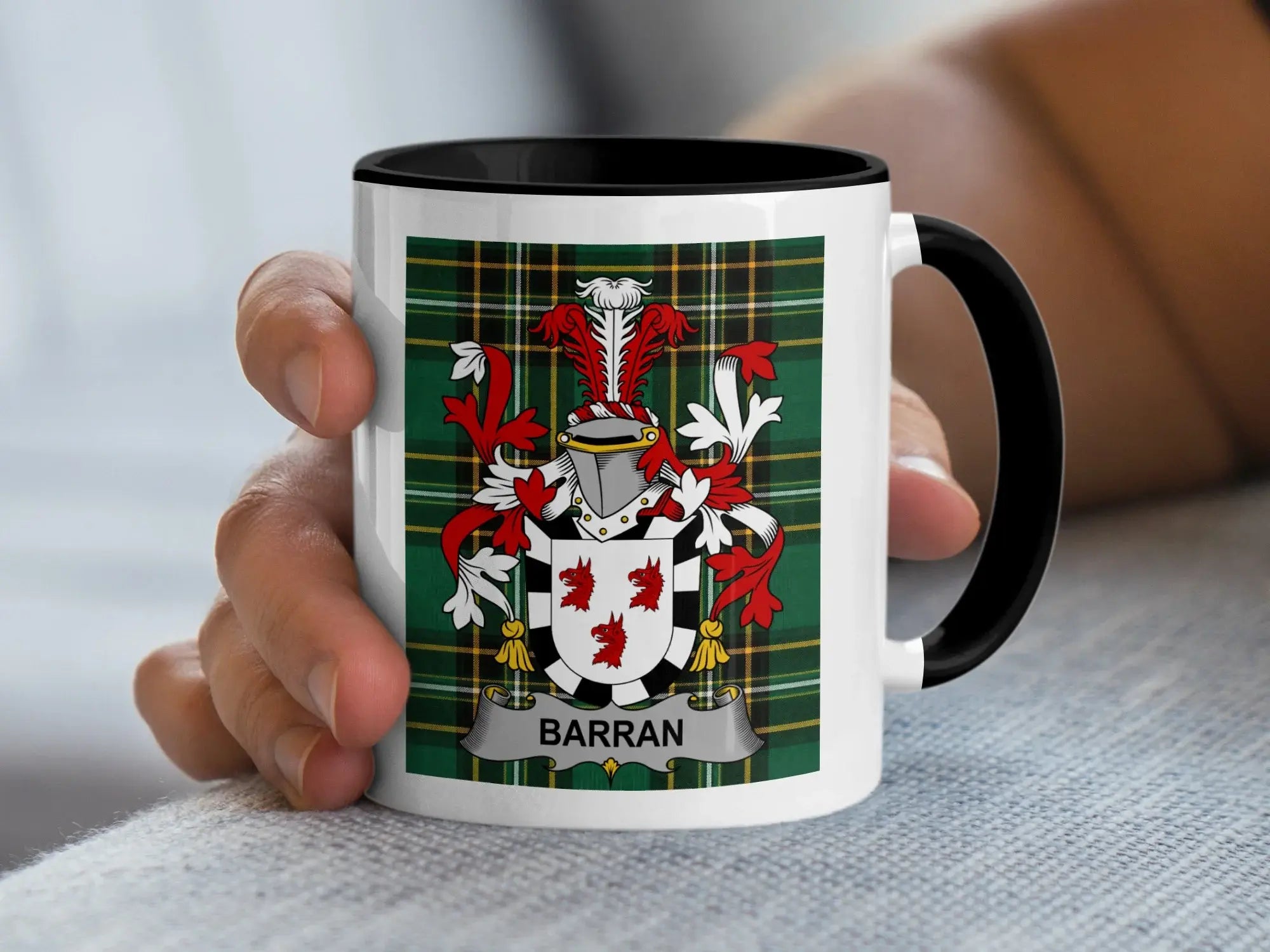 White mug with black handle featuring the Barran family crest on tartan background.