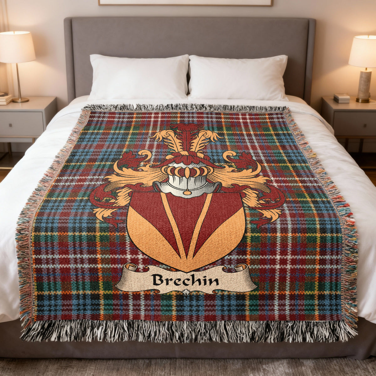 Brechin family crest emblem on a Caledonia tartan woven blanket