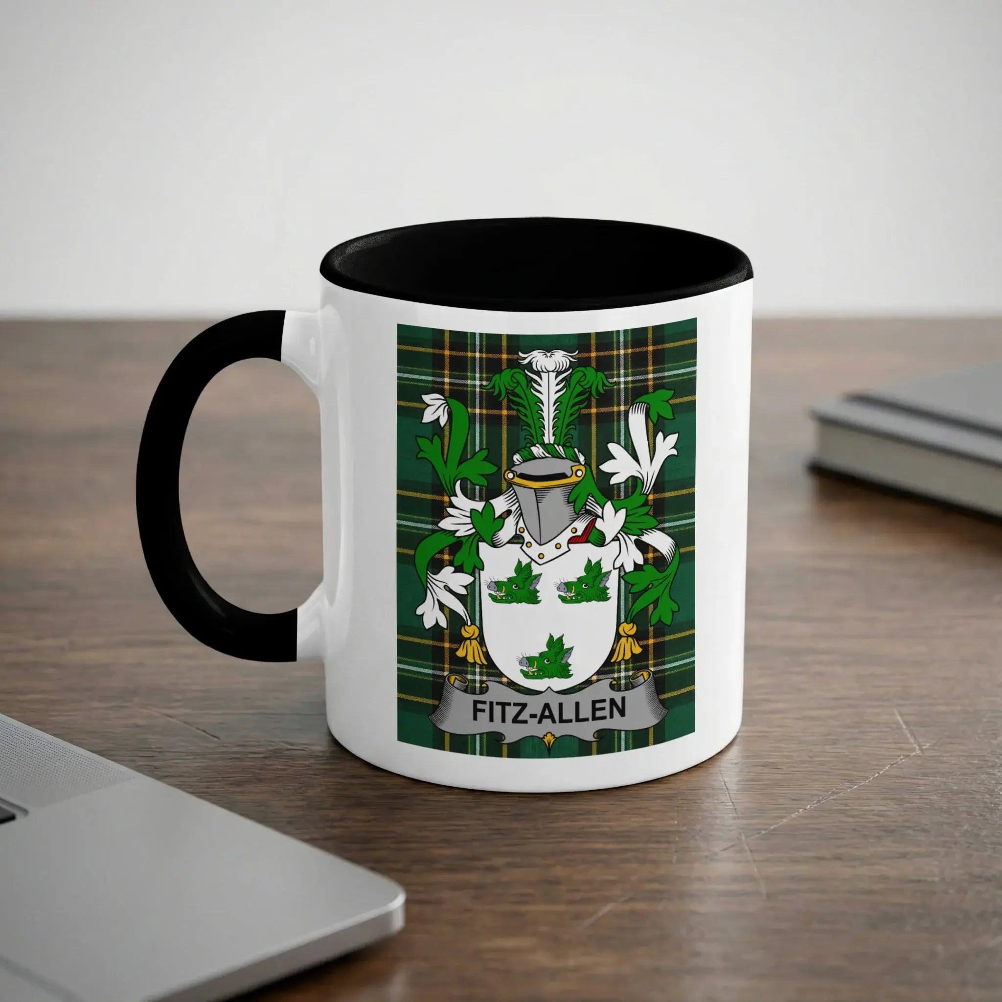 White mug with black handle featuring Fitz-Allen coat of arms on green plaid background.