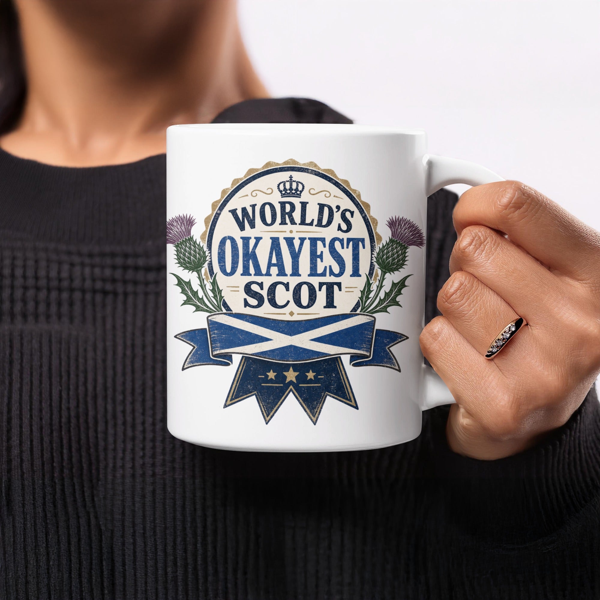 Mug with "World's Okayest Scot" and Scottish flag design.