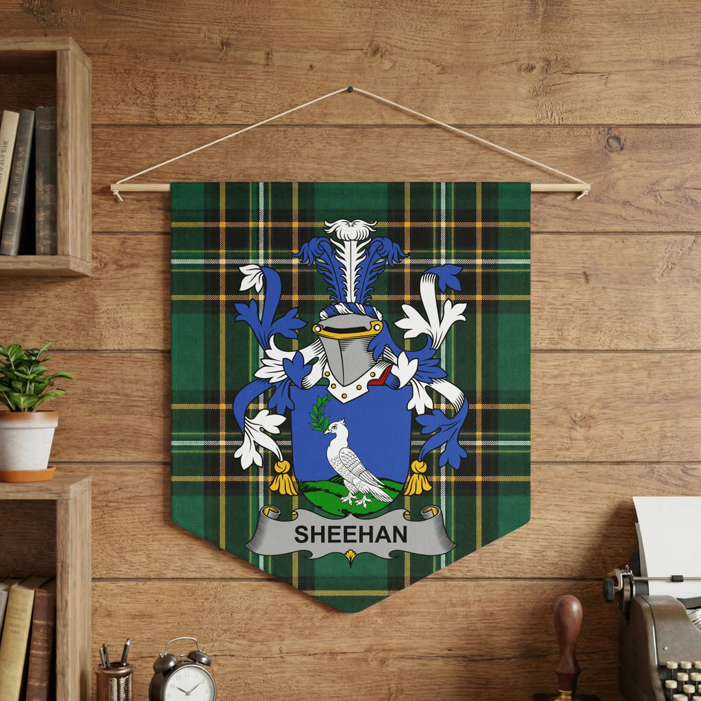 Sheehan family crest wall pennant on the Irish National Tartan, hanging on a wooden wall