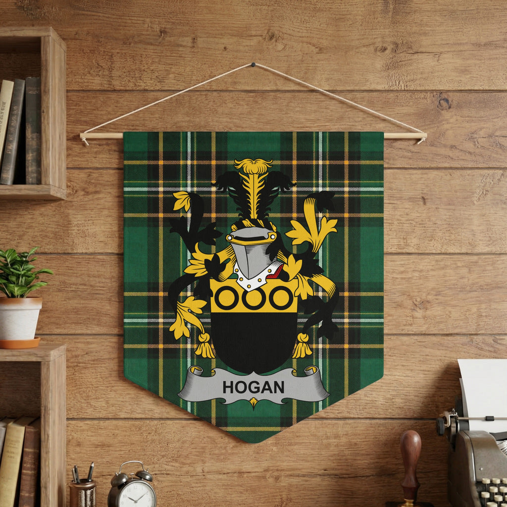 Hogan family crest on green tartan banner hanging on wooden wall.