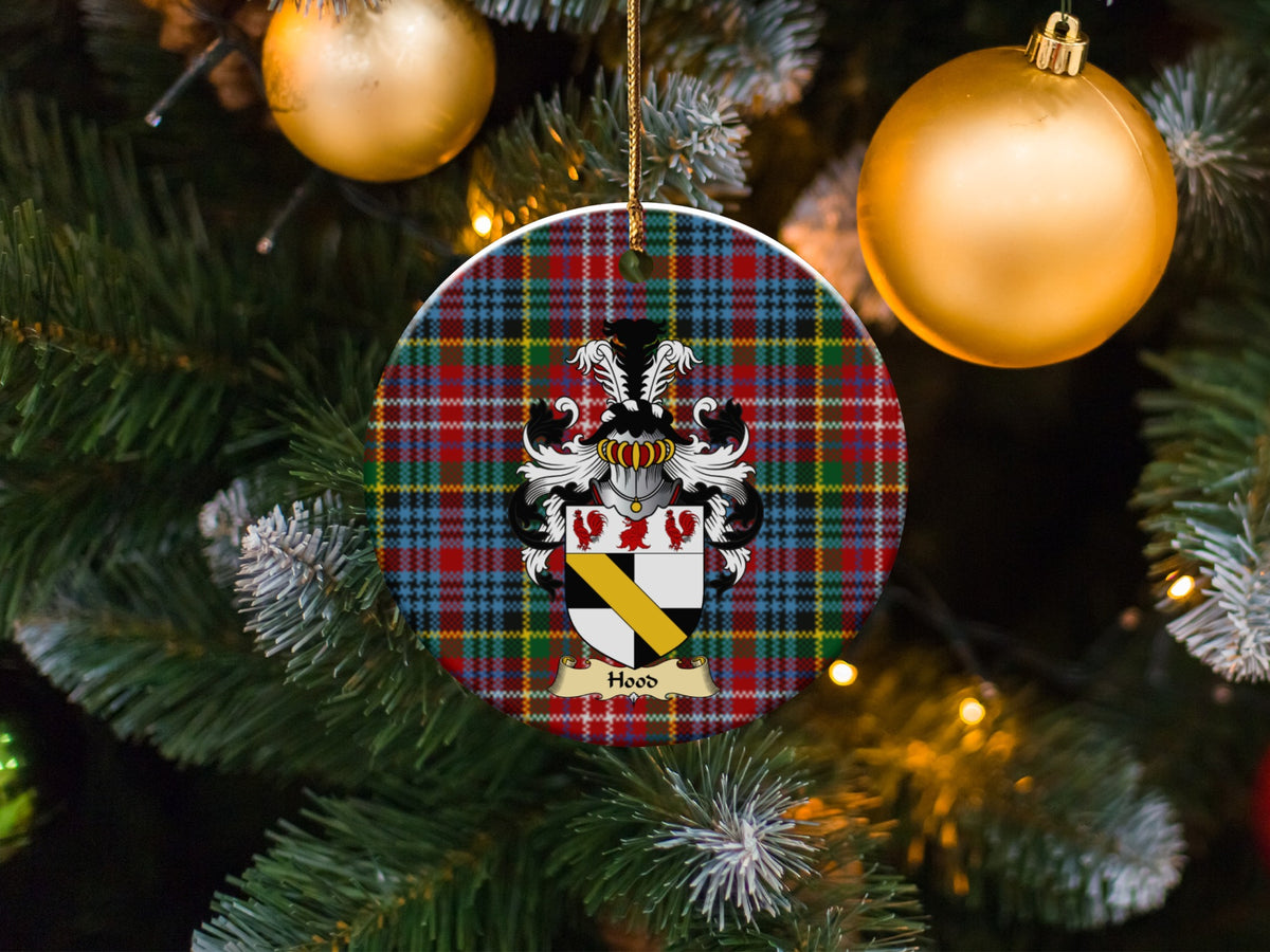 Hood family emblem ceramic Christmas ornament with Caledonia tartan background in festive holiday décor