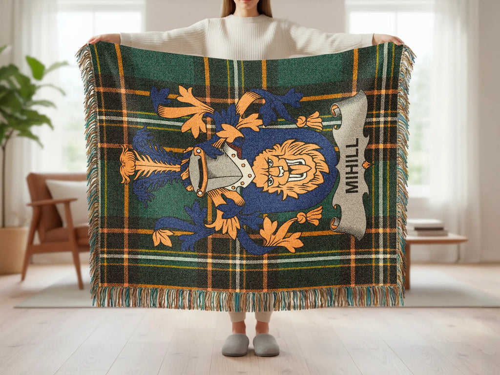 Tartan blanket with lion crest and "MIHILL" text, held by person.