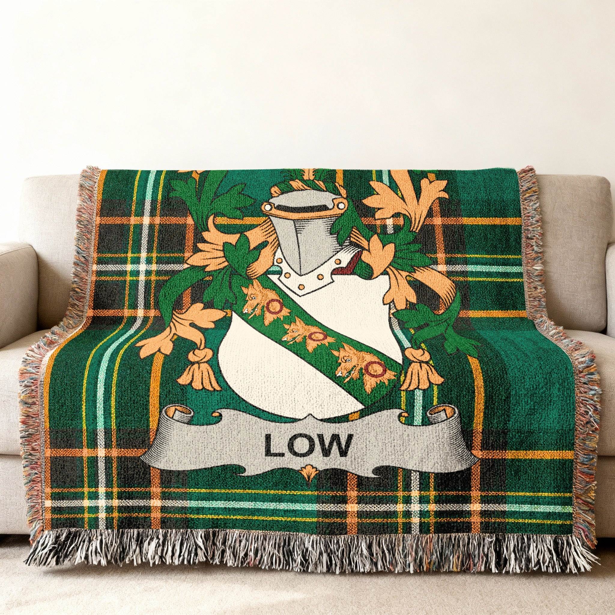 Green plaid throw blanket featuring the Low family crest.