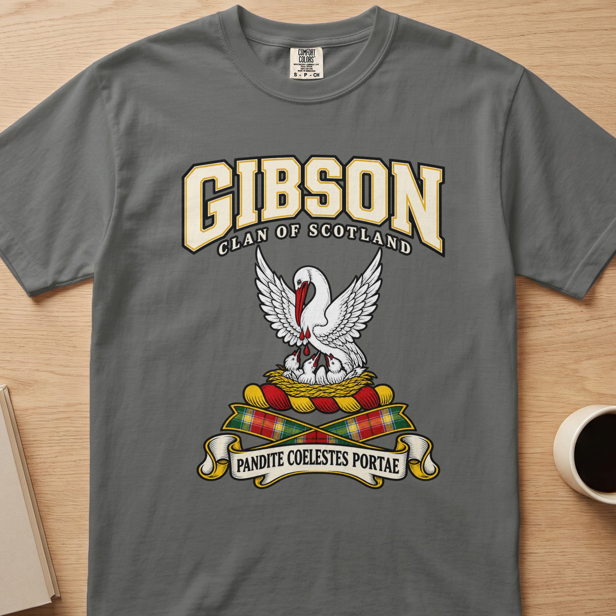 Gibson white bird with lifted wings graphic on a charcoal gray Comfort Colors T-shirt, front view
