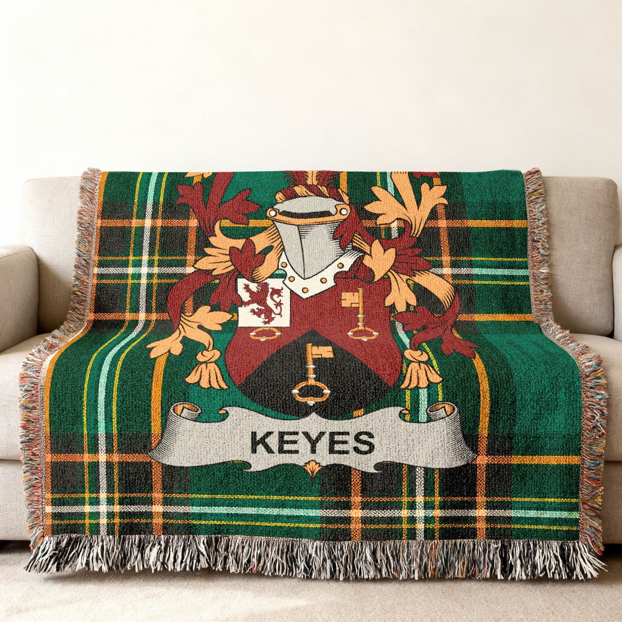 Green tartan throw blanket with Keyes family crest.