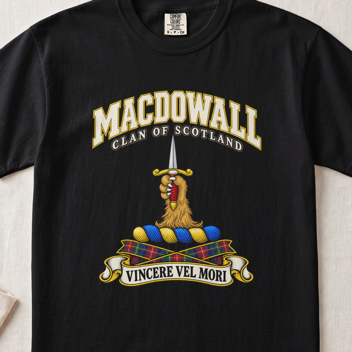 MacDowall Scottish clan T-shirt in Black, front view with a golden paw holding an upright dagger and motto banner.