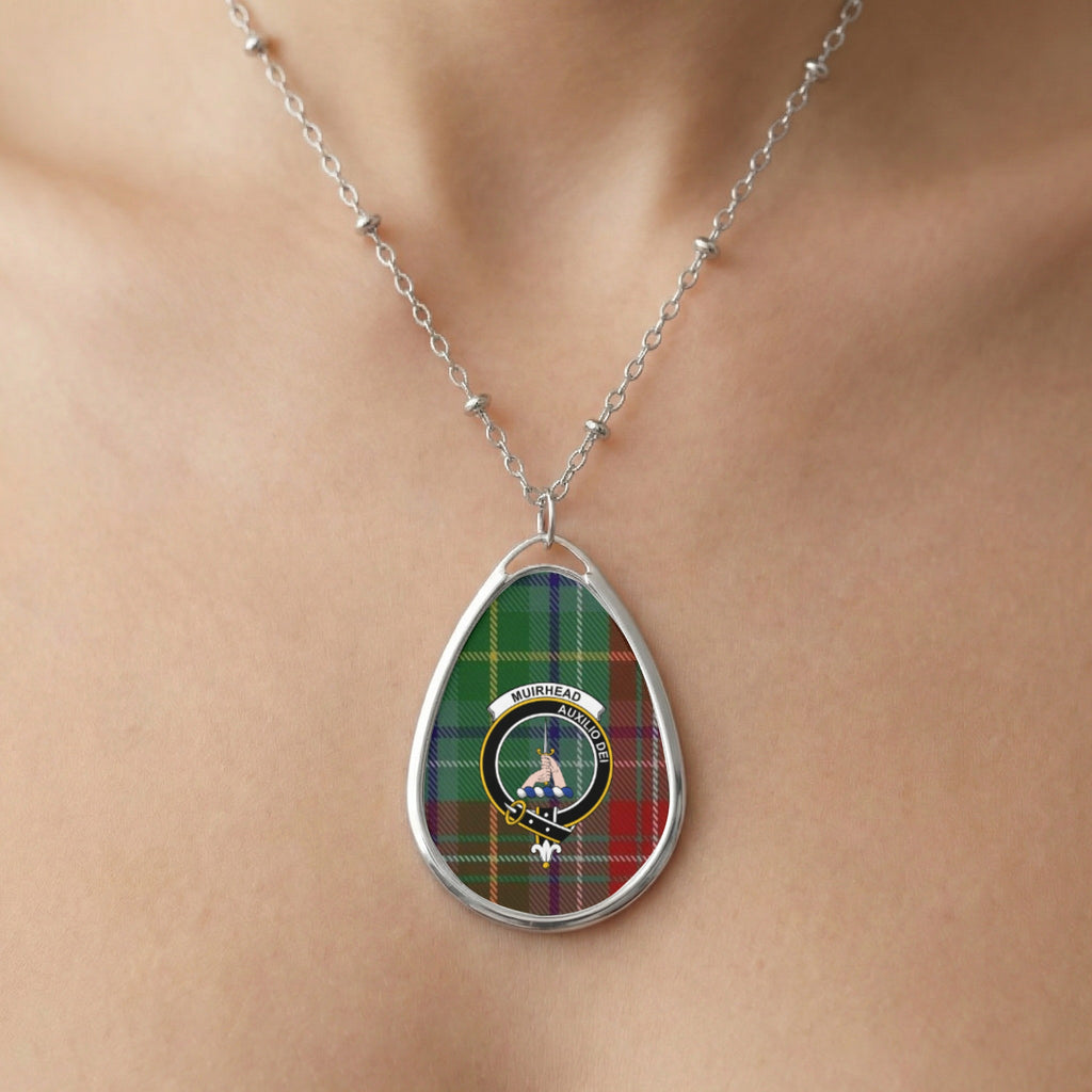 Tear-drop pendant necklace with Muirhead tartan and crest on a person's neck.