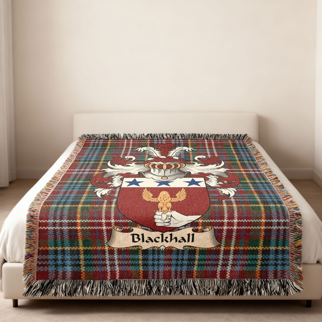 Blackhall family crest emblem on a Caledonia tartan woven blanket