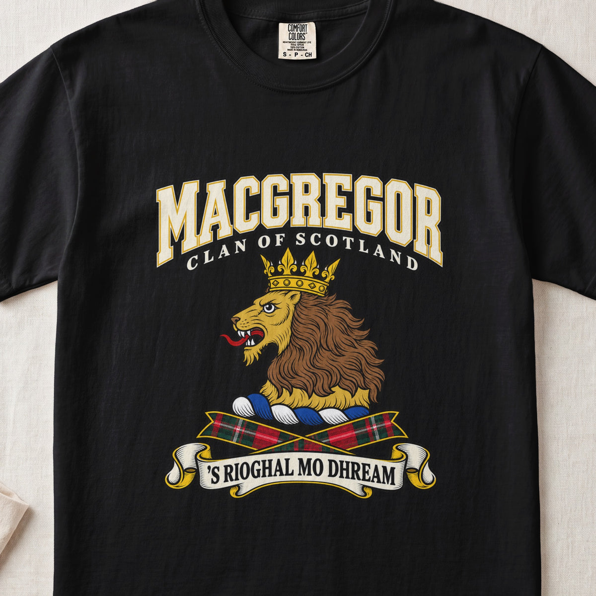 MacGregor graphic T-shirt in Black, front flat lay showing varsity lettering and gold lion head with brown mane and gold crown.