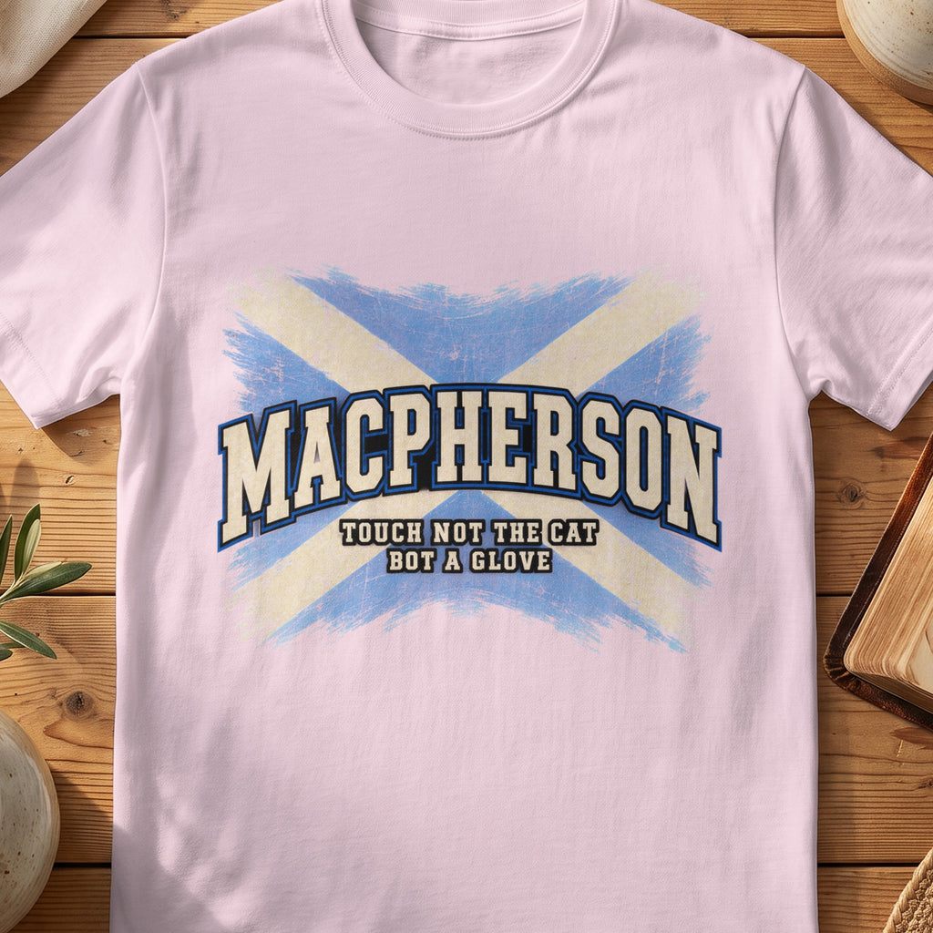 MacPherson Scottish Saltire T-shirt in Light Pink, with distressed blue and cream flag and “Touch Not the Cat Bot a Glove” lettering.