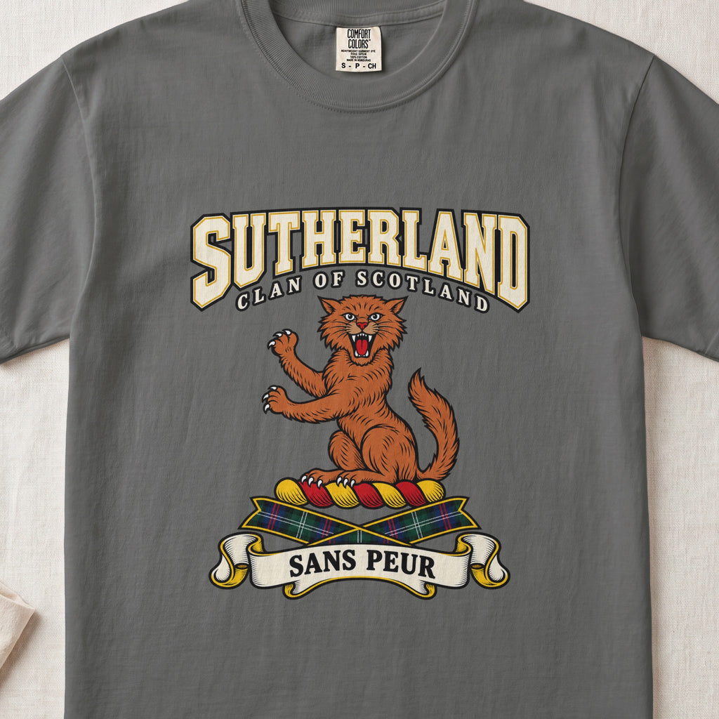 Sutherland graphic T-shirt in Pepper gray, front flat lay showing varsity lettering and orange-brown wildcat with raised paws and open mouth.
