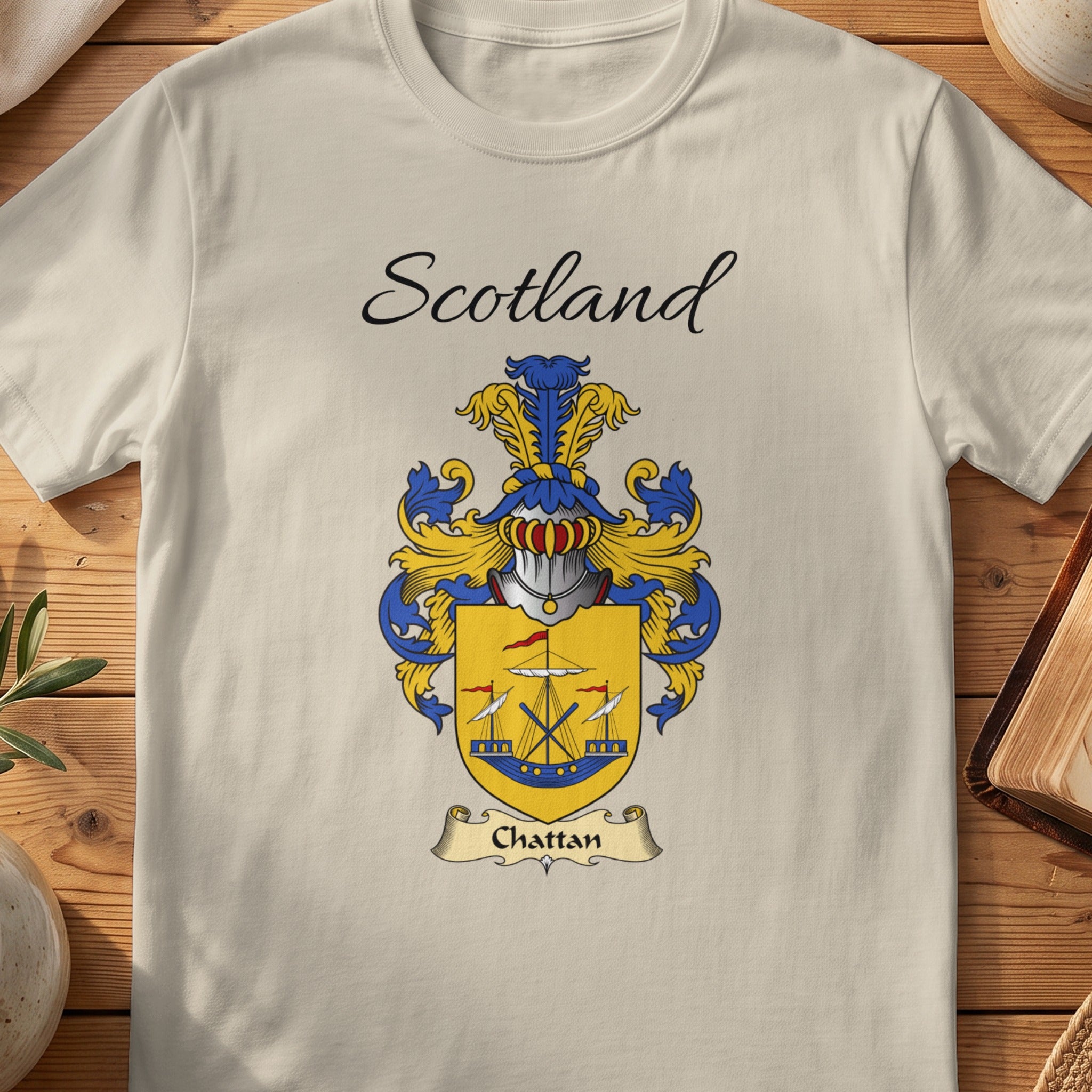 Cream t-shirt with "Scotland" text and Chattan coat of arms featuring ships.