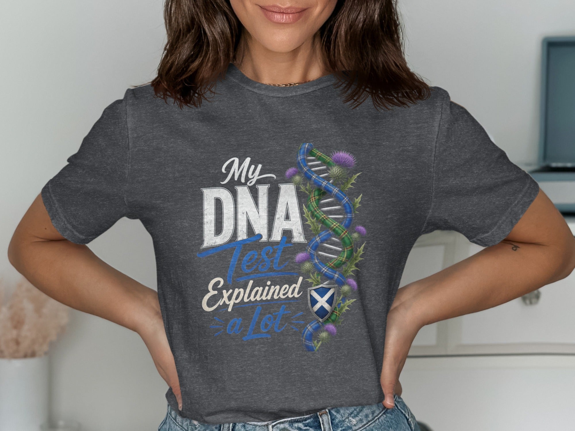 Dark gray t-shirt with "My DNA Test Explained a Lot" and Scottish thistle design.