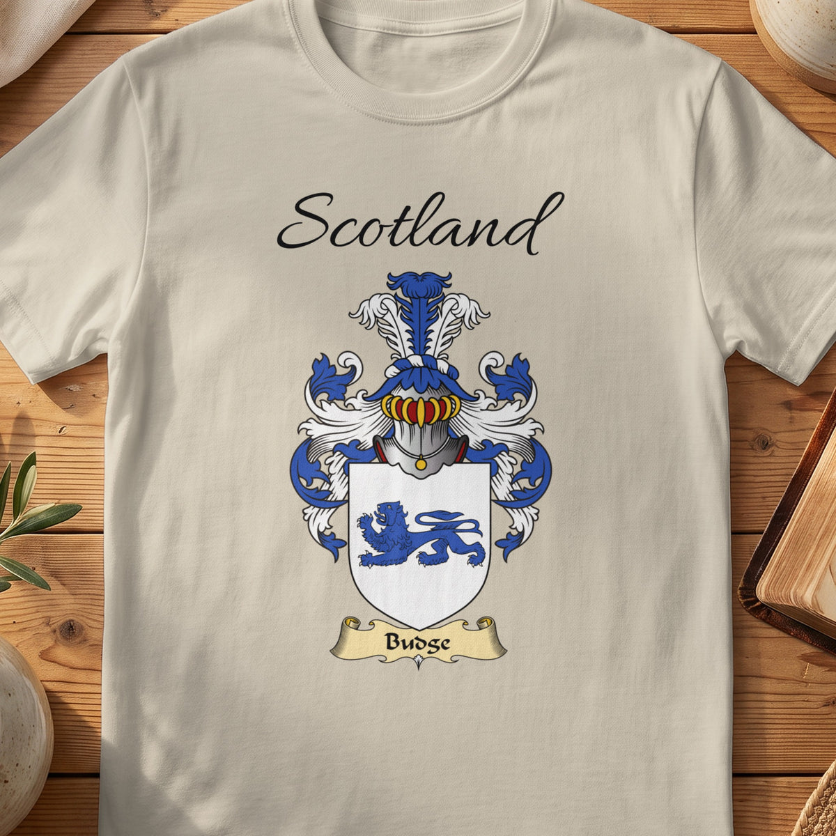 Sand Budge Scottish family shield T-shirt featuring a blue lion on a white shield
