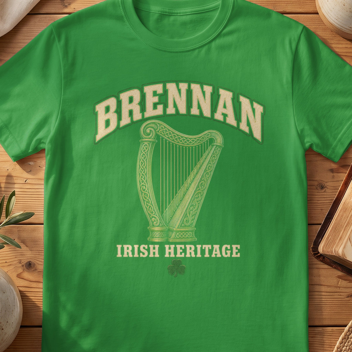 Brennan Irish harp T-shirt in Irish Green, with cream surname lettering, a gold-toned harp, green shamrock and “Irish Heritage” text.