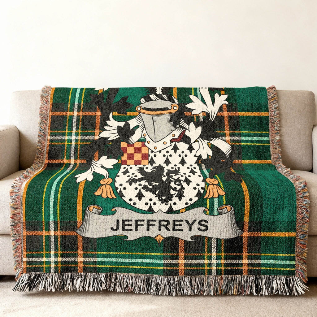 Green tartan blanket with Jeffreys family crest displayed.