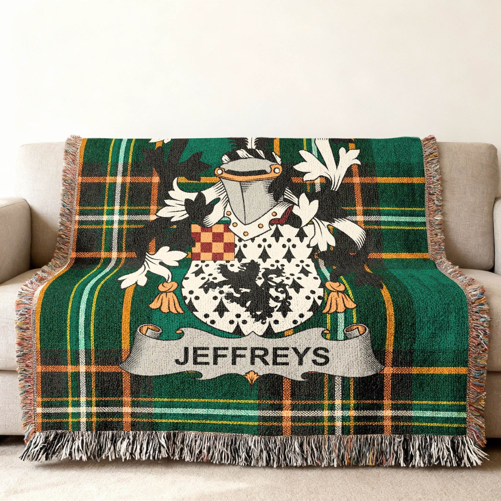 Green tartan blanket with Jeffreys family crest displayed.