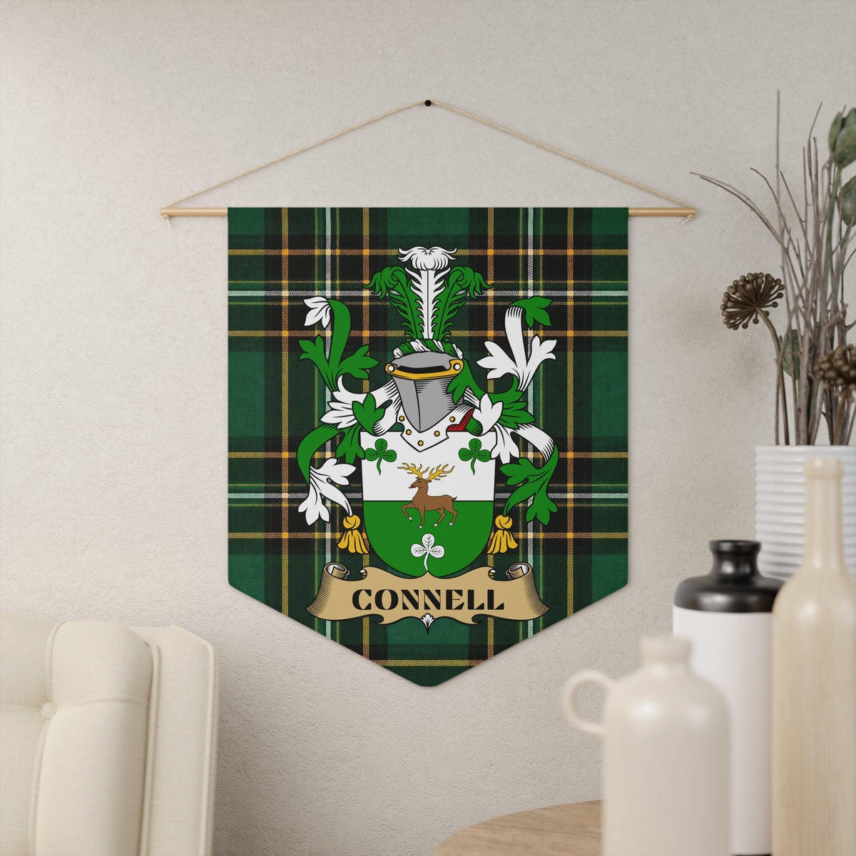 Connell family crest banner on green tartan with stag and shamrocks.