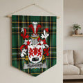 Flaherty coat of arms displayed on a green tartan banner hanging on a wall.