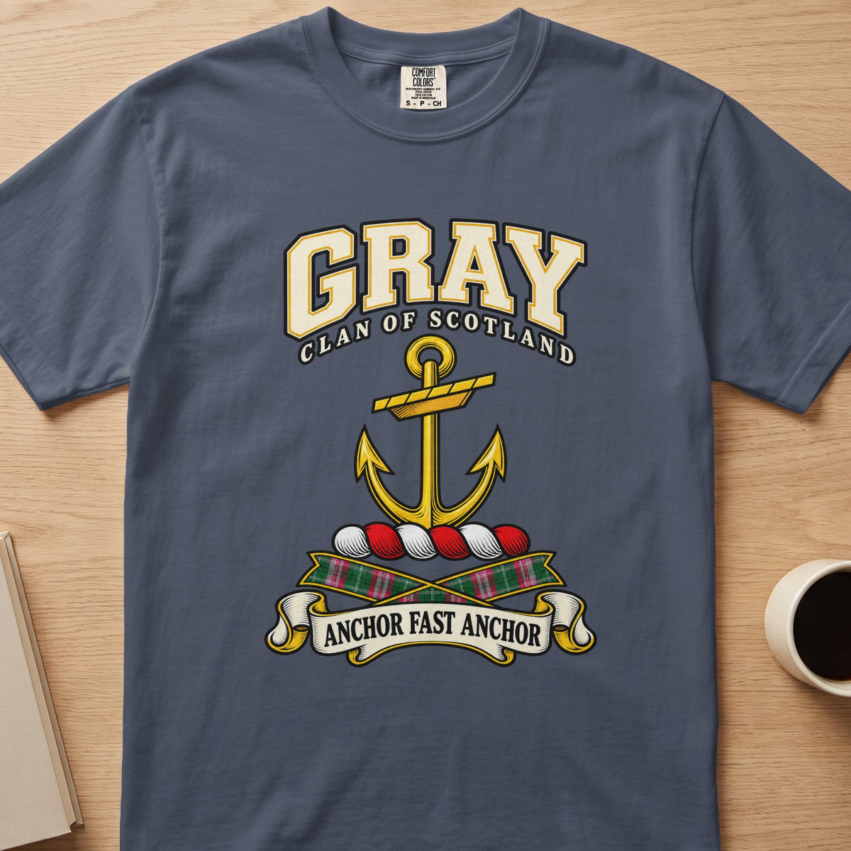 Gray clan crest with gold anchor on a slate blue Comfort Colors T-shirt, front view