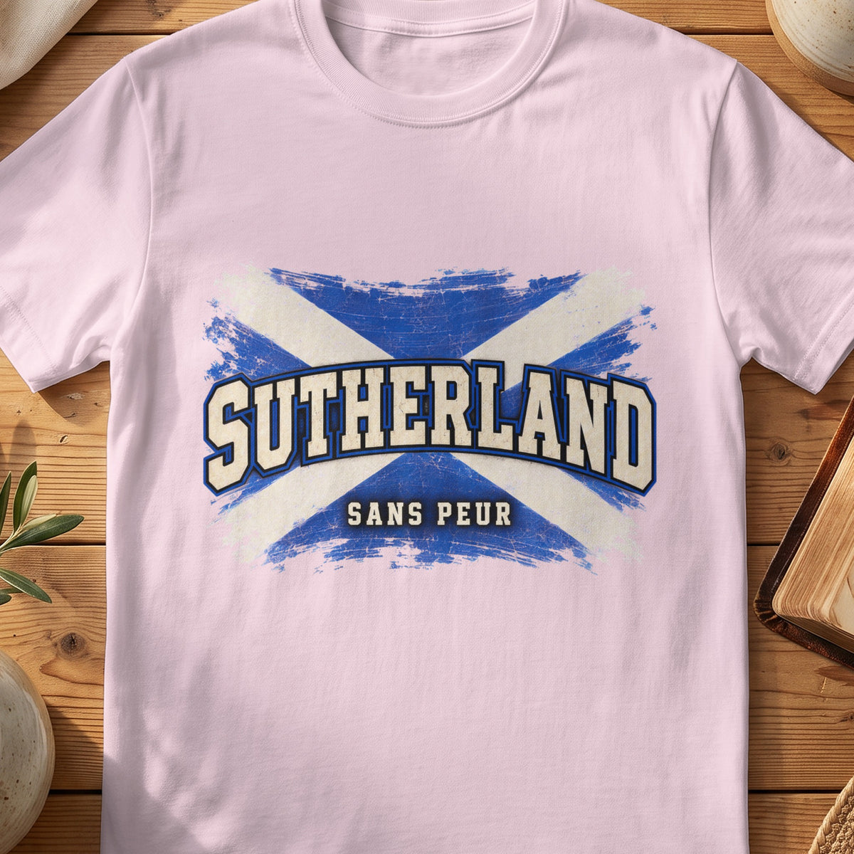 Sutherland Scottish Saltire T-shirt in Light Pink, with distressed blue and cream flag and “Sans Peur” lettering.