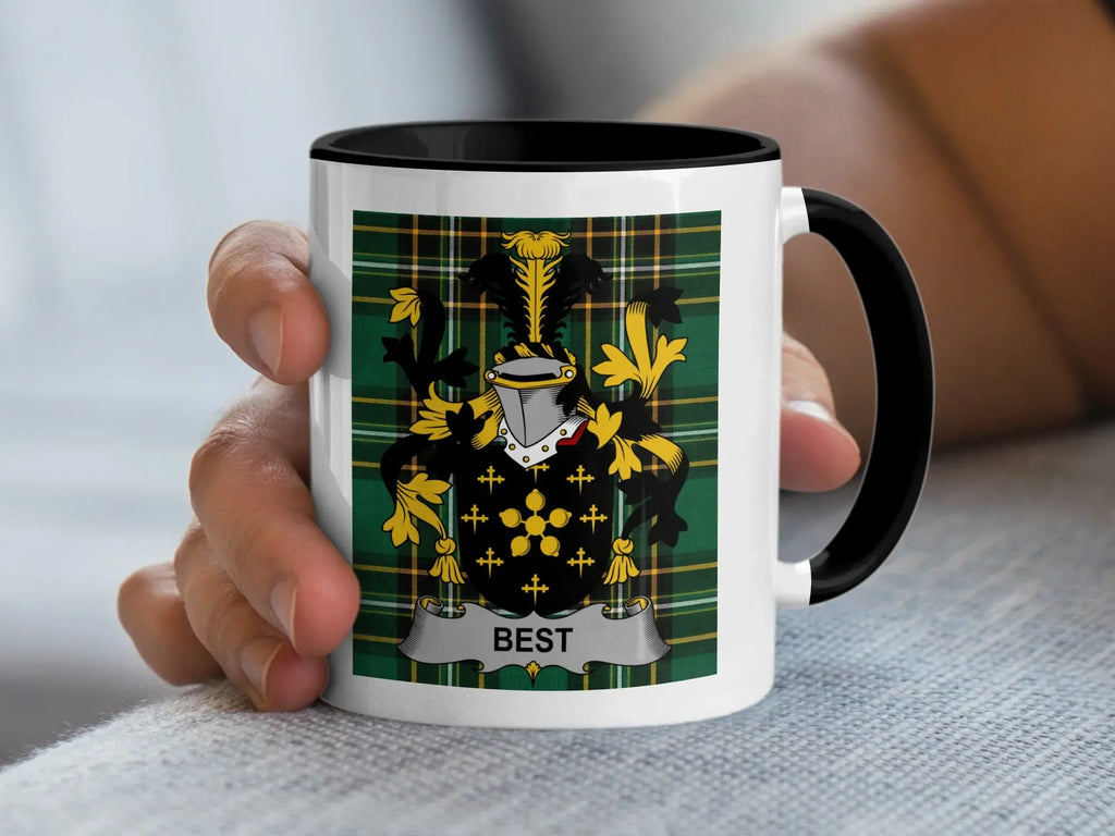 White mug with a green plaid pattern and the word "BEST" in a coat of arms.