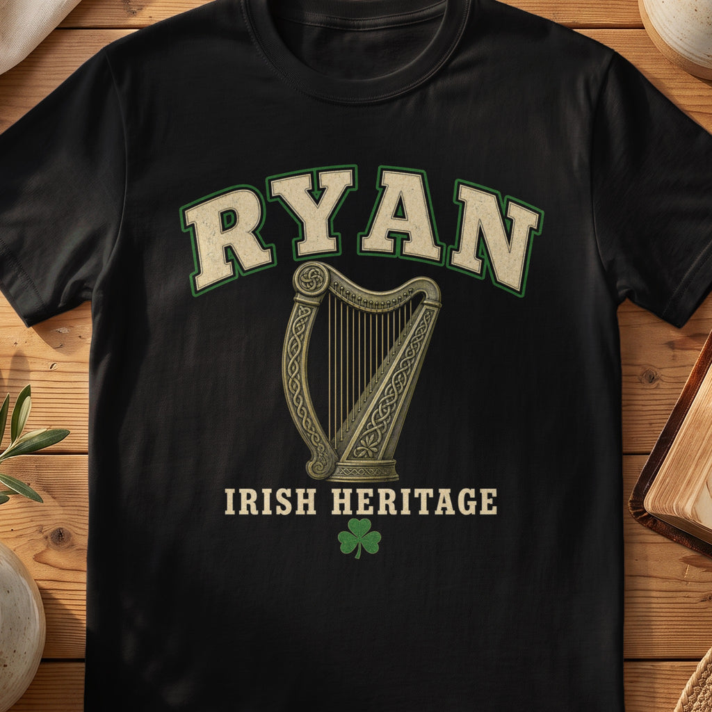 Ryan Irish harp T-shirt in Black, with cream surname lettering, a gold-toned harp, green shamrock and “Irish Heritage” text.