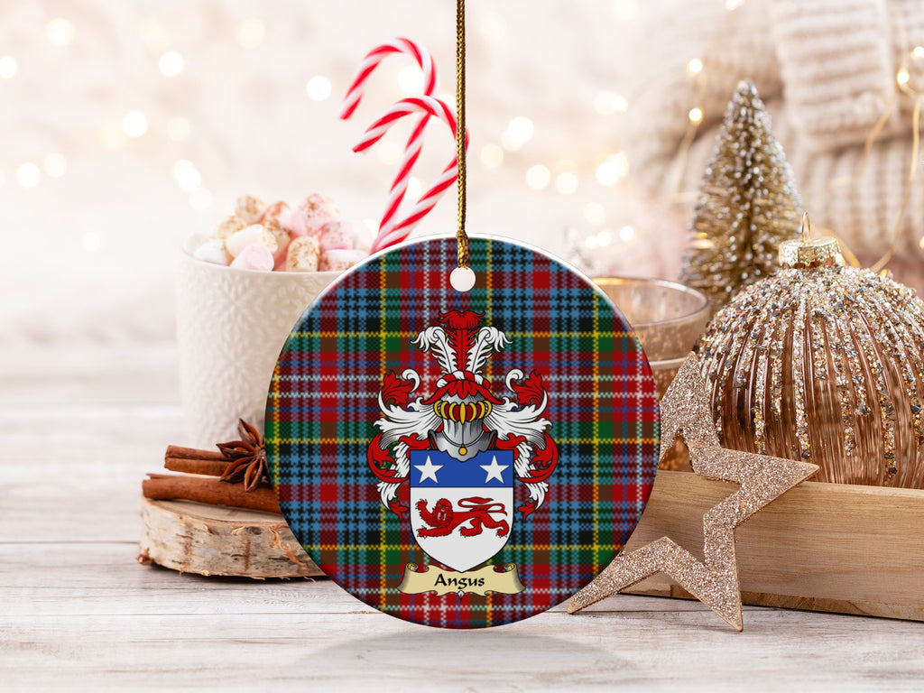 Angus family emblem ceramic Christmas ornament with Caledonia tartan background in festive holiday décor