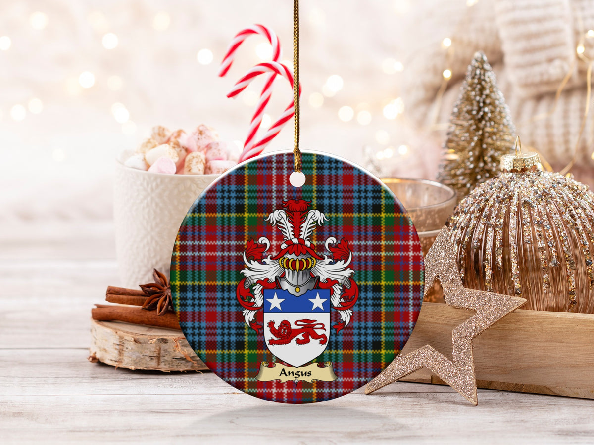 Angus family emblem ceramic Christmas ornament with Caledonia tartan background in festive holiday décor