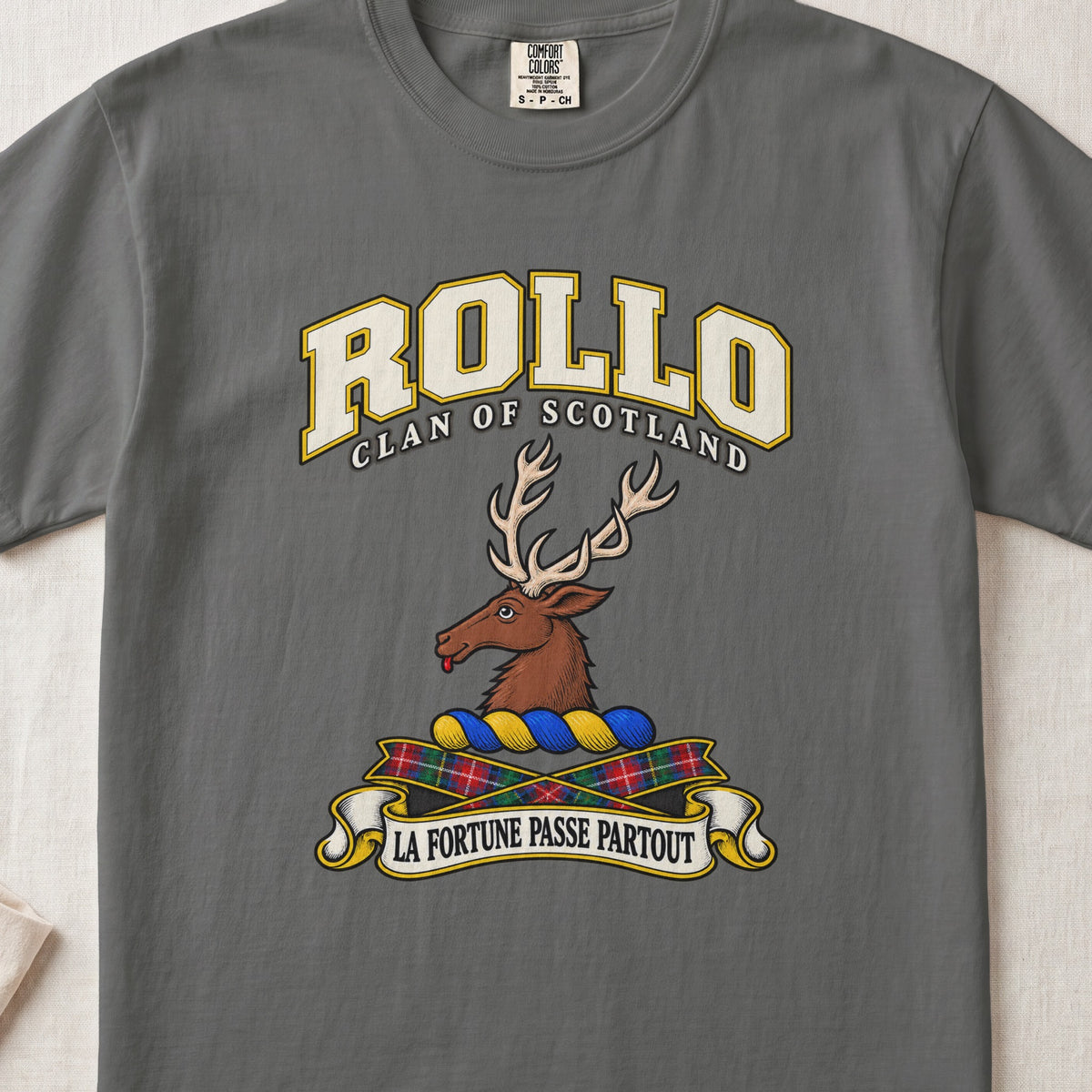 Rollo Scottish clan T-shirt in Pepper, front view with a brown stag head with antlers and motto design.