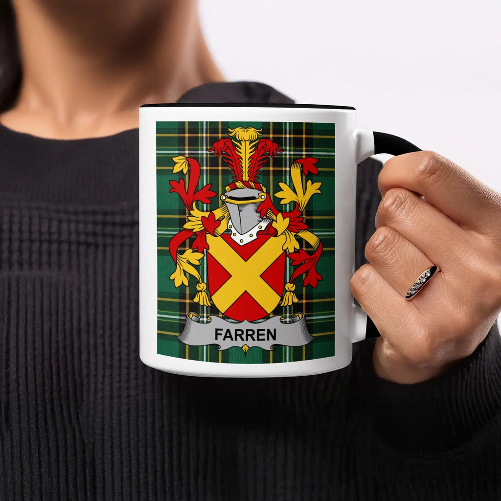 White mug with Farren family crest on green tartan background.