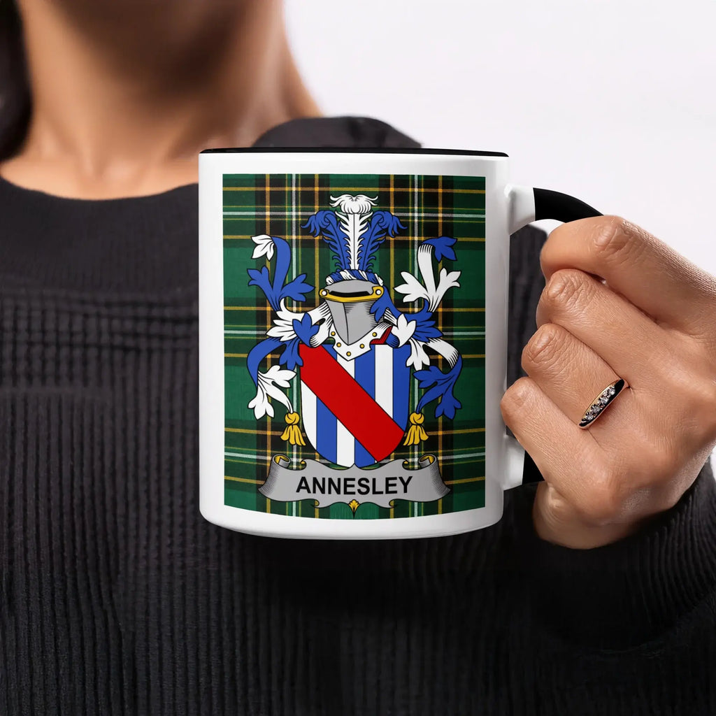 Mug with Annesley tartan crest, held by a person.