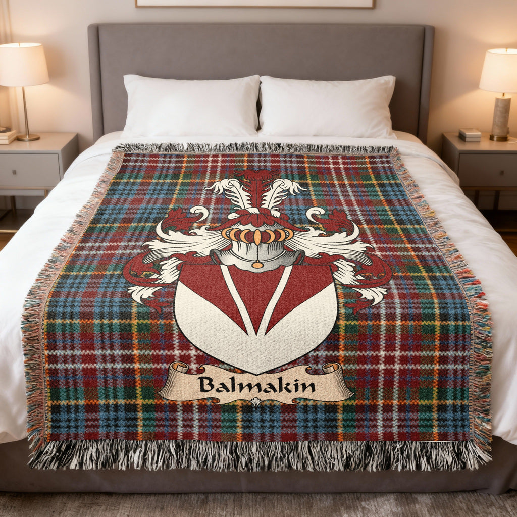 Balmakin family crest emblem on a Caledonia tartan woven blanket