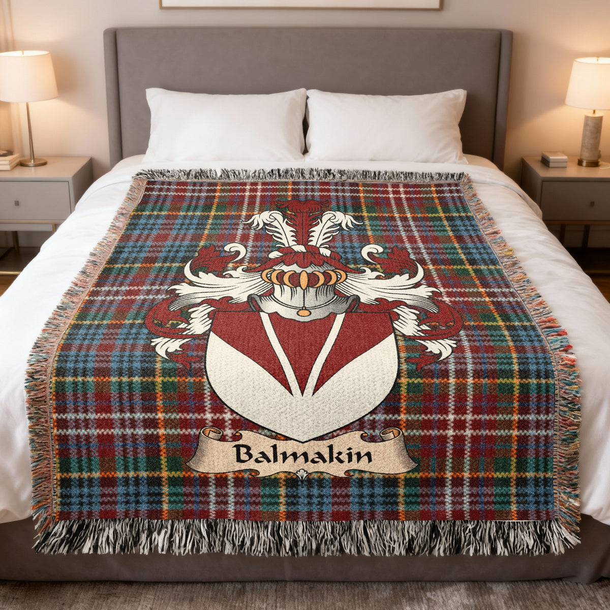 Balmakin family crest emblem on a Caledonia tartan woven blanket