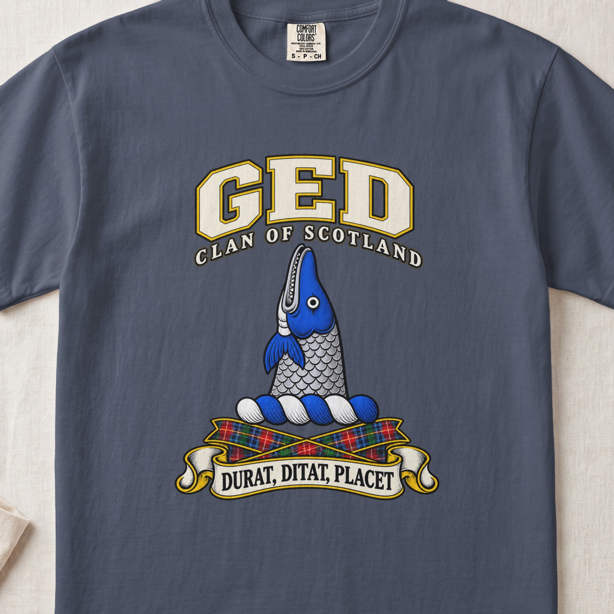 Ged Scottish clan T-shirt in Midnight, front view with an upright blue-and-silver fish and motto banner.